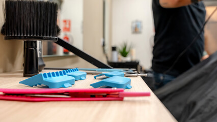 Barbershop tools neatly organized on a wooden counter