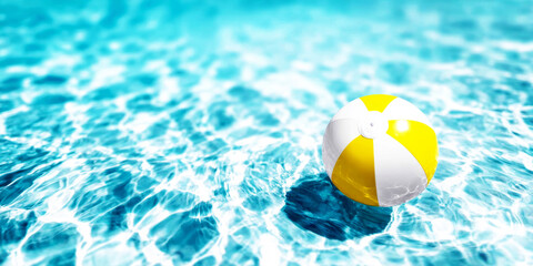 Yellow and white beach ball gently floating on turquoise swimming pool water, symbolizing summer fun and refreshing holidays