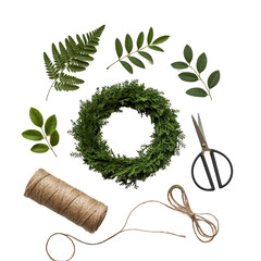 Diy wreath making supplies including greenery scissors twine and a wreath form