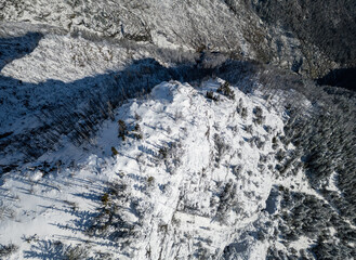 Fototapeta premium Snowy Mountain Ridge in British Columbia, Canada Under Bright Blue Sky