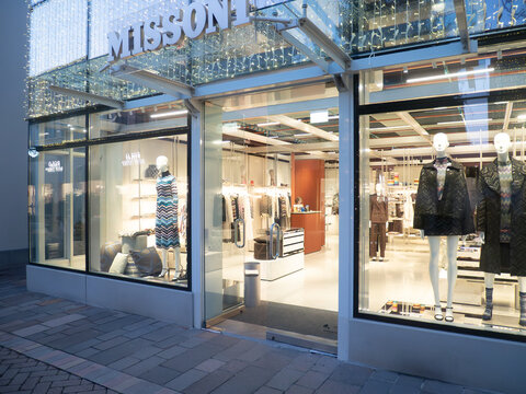 Missoni luxury fashion boutique storefront in Fidenza Village during Christmas shopping season in Italy