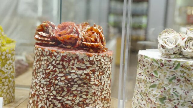 Gourmet Nut Covered Dessert Cake with Caramel Decoration in Shop