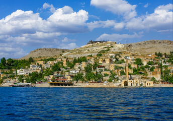 Fototapeta premium Halfeti district of Şanlıurfa province, Turkey, was submerged by the dam waters and the old abandoned district landscape. View of the sunken district of Halfeti.