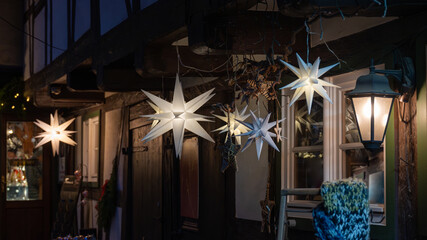 White Christmas stars in fron of a half-timbered house