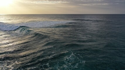 I watch the waves and contemplate the sunset by the sea