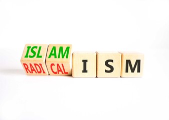 Islamism or radicalism symbol. Concept words Islamism or Radicalism on beautiful wooden cubes. Beautiful white table white background. Business islamism or radicalism concept. Copy space