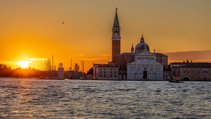 Fototapeta premium Morning in Venice - view across the lagoon to the rising sun and Basilica di San Giorgio Maggiore