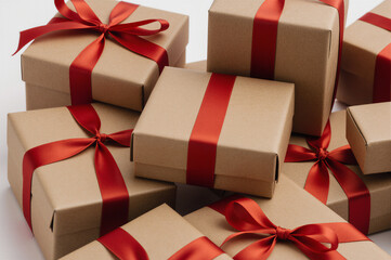 A festive arrangement of wrapped gifts with red ribbons, symbolizing joy and celebration.