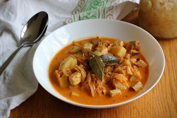 Healthy version of traditional Czech and Slovak cabbage soup (called zelnacka or kapustnica) cooked from sauerkraut, potatoes, cumin, sweet pepper, cream and smoked tofu cheese instead of sausage