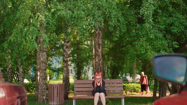 seated lady in park experiencing urban stress, pensive lady with bright braids in bustling city park, woman sporting vibrant pink plaits sitting on wooden bench amidst busy city traffic
