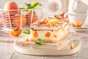 Fresht and sweet peach cheesecake freshly baked in the kitchen.