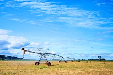 New Zealand Farm Irrigation Beam Over Dry Summer Paddock