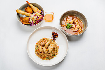 Enjoy rich noodles, crispy spring rolls, and spicy soup, all beautifully presented
