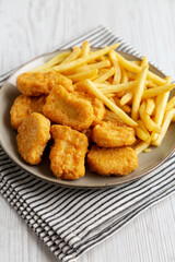 Chicken Nuggets with French Fries on a Plate