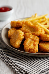 Chicken Nuggets served with French Fries and Ketchup