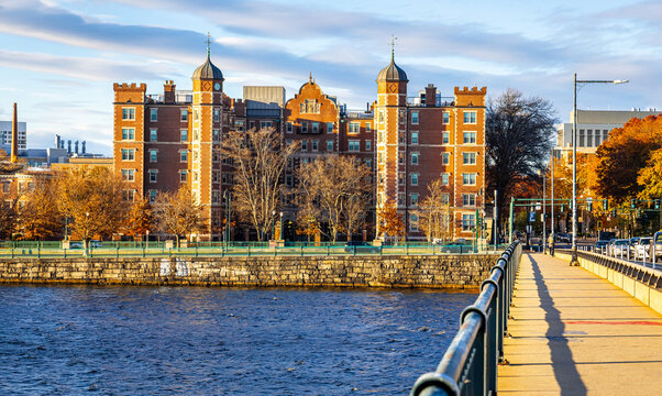 Charles River and Cambridge Skyline with Runners on Riverside Path