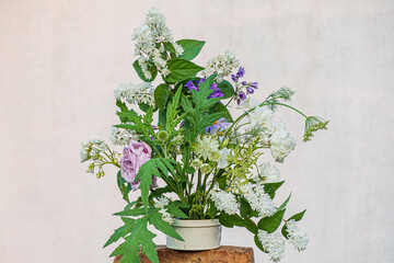 A stunning collection of white and purple flowers arranged beautifully, bringing warmth and joy