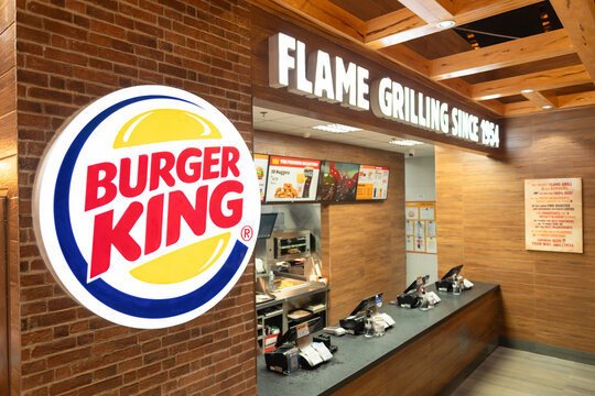 Burger King illuminated sign and service counter with cash registers