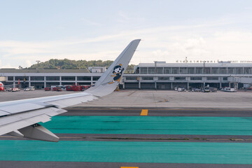 Fototapeta premium Airport terminal view from taxiing Scoot Airbus A321neo