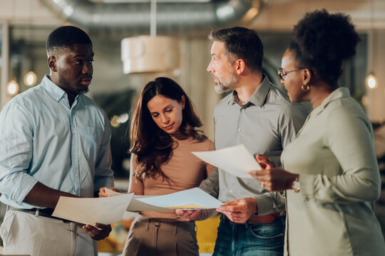 Diverse business team collaborating on project documents