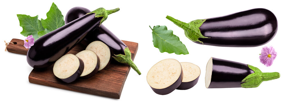 eggplant with slices, leaves and flower on wooden board isolated on white background. clipping path - Powered by Adobe