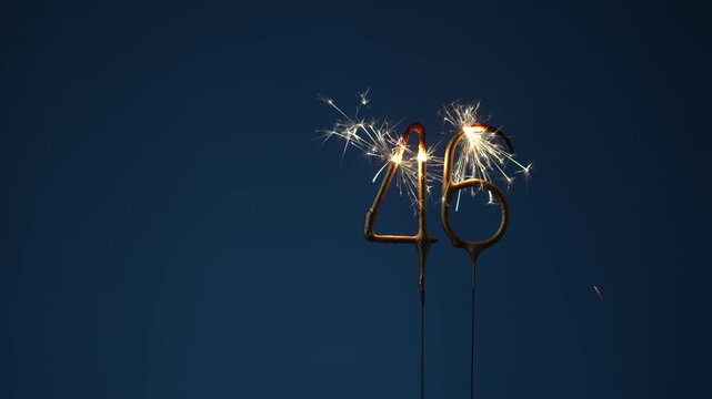 46 years celebration festive background made with Bengal fires in the form of number Forty six.