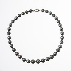 Tahitian pearl necklace with 18kt white gold clasp photographed on a white background