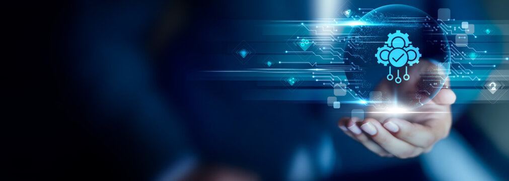 Automation concept, Businessman hold Automation icon for streamlining workflows, reducing manual tasks and improving operational efficiency.