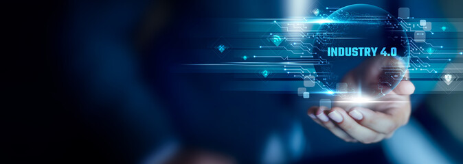 Industry 4.0 concept, Businessman hold Industry 4.0 text. smart automation, connected machines, real-time data, digital factories, advanced robotics, intelligent systems
