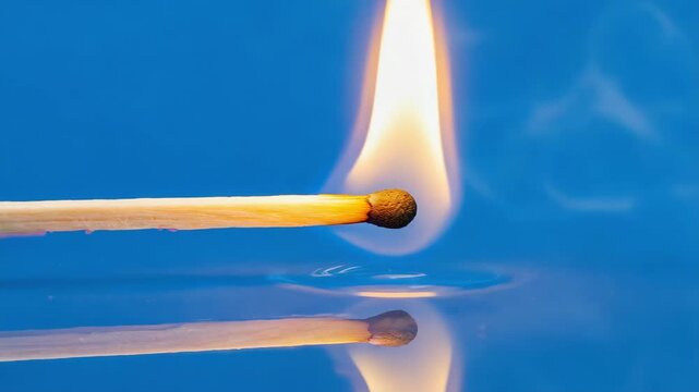 Progression of a burning match in three stages from ignition with smoke to a steady flame. Conceptual composite for process, transformation, energy and the passage of time