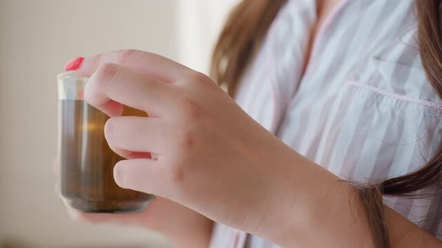 Caucasian Woman Showing Hands With Fresh Manicure While Holding Warm Cup, Closeup On Fingers And Glass Rim, Subtle Steam And Morning Light, Intimate Detail Shot Of Domestic Calm And Ritual