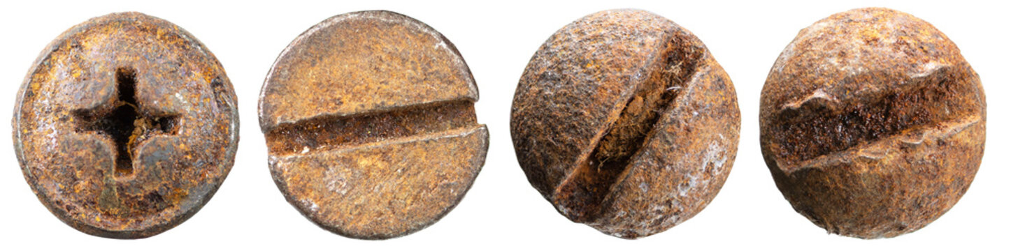 Close-up view of old rusty screw heads isolated on a white background.