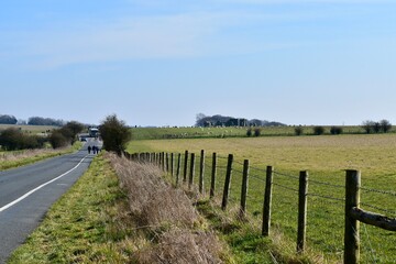 Obraz premium Landscape with a road towards Stonehenge, Salisbury, England, UK