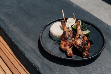 grilled chicken wings,Grilled Chicken with Rice on Plate.Malaysian Grilled Chicken with Steamed Rice.Ayam Bakar with White Rice Food Photography.Traditional Asian Grilled Chicken Meal.Close-Up of Gril