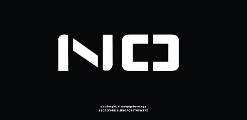 A futuristic, geometric block font with sharp cutouts and bold techno-inspired shapes.