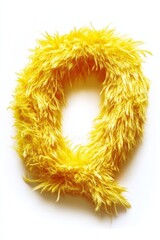 Fototapeta premium Fluffy yellow letter Q stands out against a clean white backdrop, capturing attention with its playful texture and vibrant hue