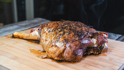 Whole roasted lamb leg with golden herb crust, served with cassava and olives. Juicy, tender, and ready to carve. A complete festive meal on a board.