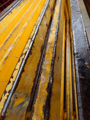 Weathered yellow construction metal grunge background.