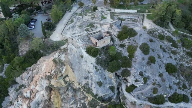 Aerial drone footage of the Antiche Terme Romane Libere, showcasing ancient Roman thermal ruins, natural pools, and the surrounding landscape. Captured from above with cinematic movement and clear arc