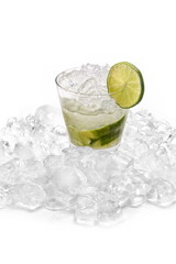 Classic lime caipirinha with sugar, muddled lime, and cachaça on a bed of ice against a white background.