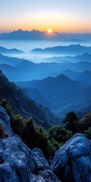 A breathtaking view of mountains bathed in a serene blue hue at sunset, showcasing the natural beauty and tranquility of the landscape.