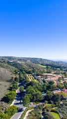 Fototapeta premium Aerial shot of luxury homes at the Pelican Hill Resort in Newport Beach California USA