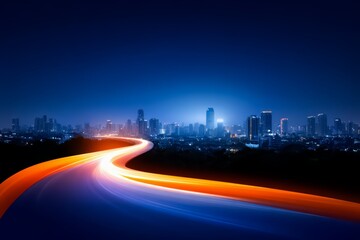 Fototapeta premium City skyline is shown with a long road that is lit up with a bright orange glow. The city appears to be at night