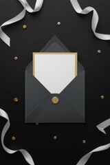Envelope with card ribbons and decorative dots on a textured black surface