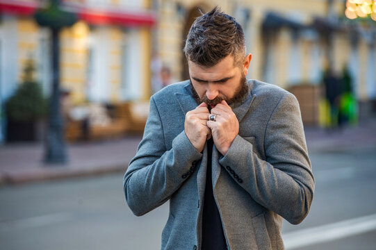 Stylish businessman feel cold in autumn street. Urban style. City street and stylish man. Bearded man in autumn jacket on street. Businessman has business style. Business man in urban city - Powered by Adobe