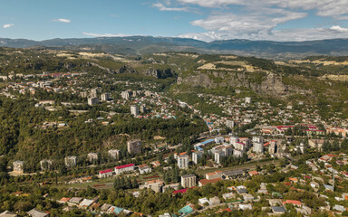 Chiatura cityscape with hills and valley from above