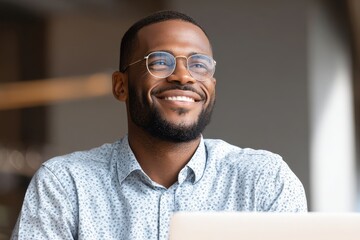 A professional man in a modern home office, brightly lit by natural light, engaged in a video conference with diverse colleagues on a sleek laptop, exuding focus and collaboration