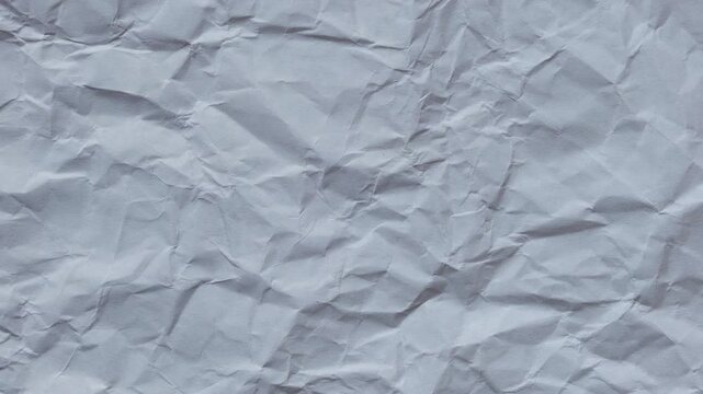 crumpled white paper texture pattern best for video background & motion graphics animation, seamless looping in 4k, stop motion animation, wrinkled surface and grain texture footage

