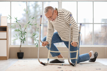 Senior man with walker after fall at home