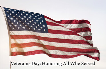Obraz premium A magnificent American flag, sharp red and white stripes and a constellation of brilliant white stars on a deep blue canton.Prominently centered, is the phrase 'Veterans Day: Honoring All Who Served'.